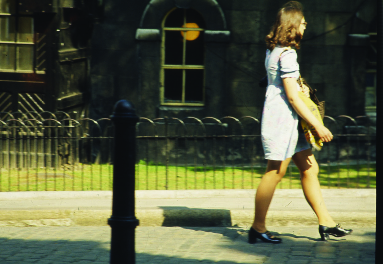 A woman strolls by the Tower of London
