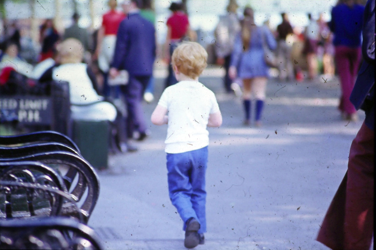 Kid plays in the street.